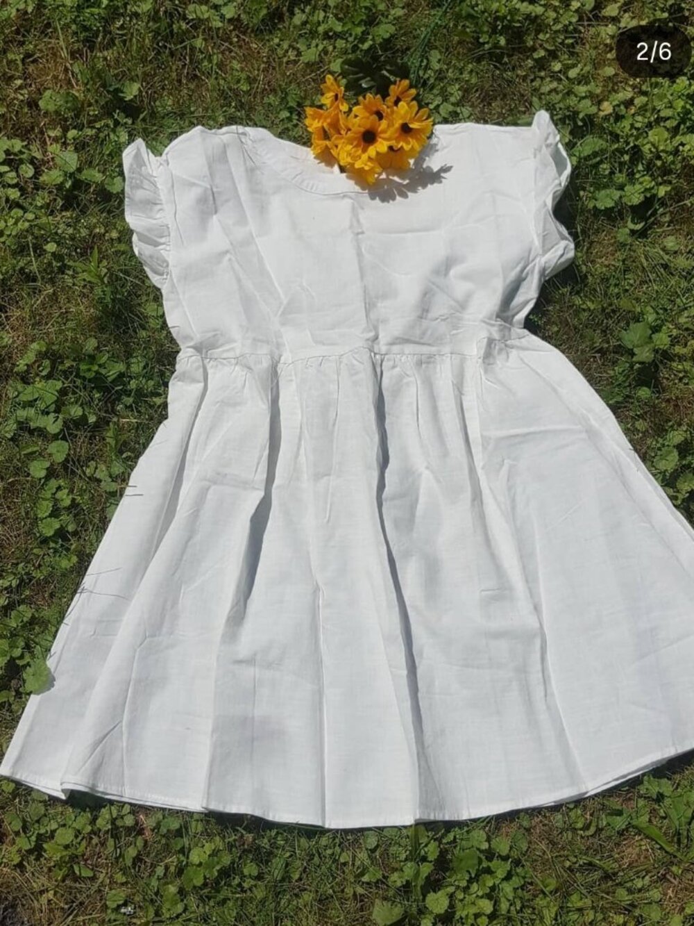 Adorable ruffled cap sleeve baby doll dress in white